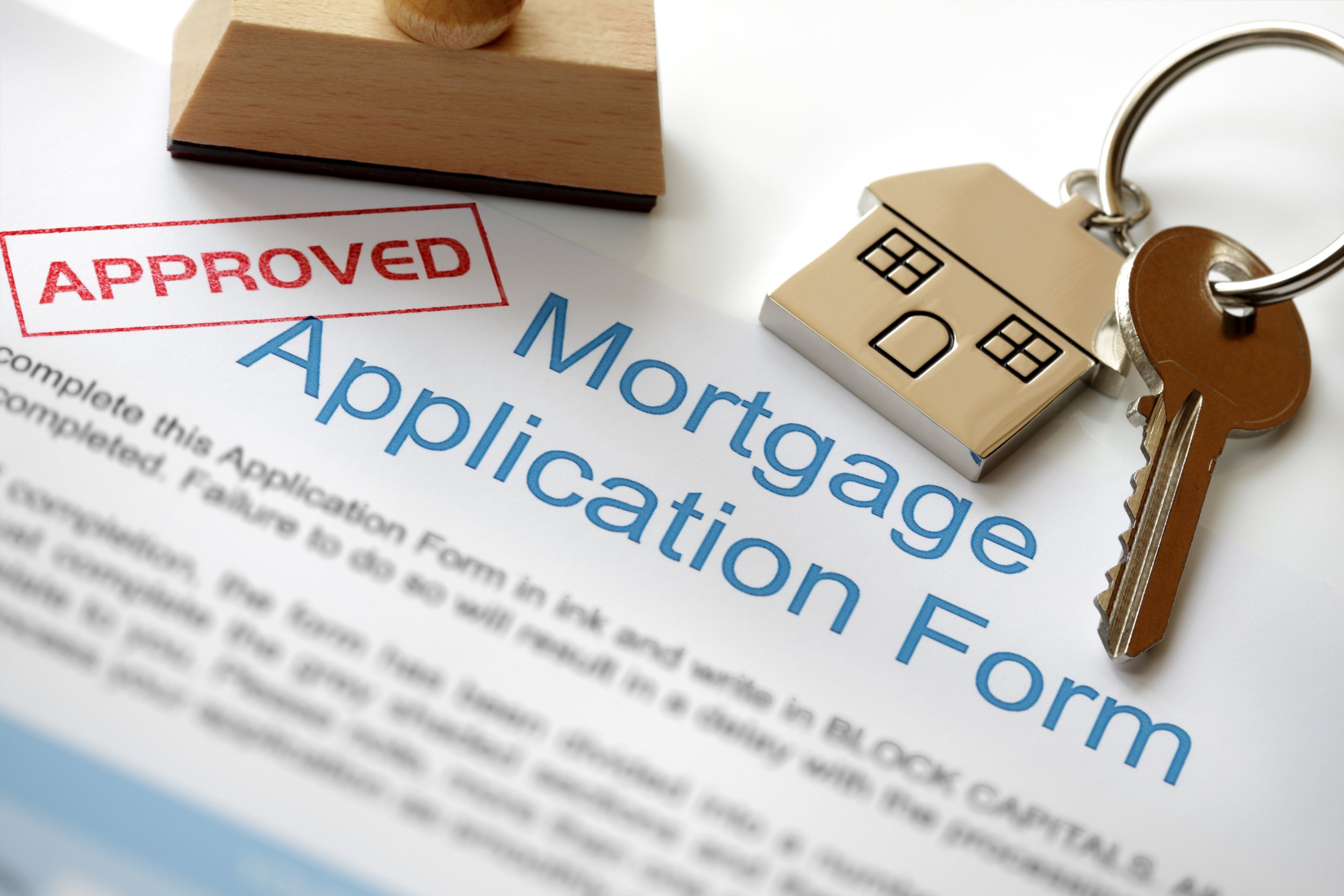 Approved mortgage application with keys